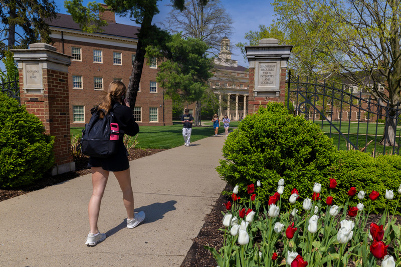 Student walking with a backpack 