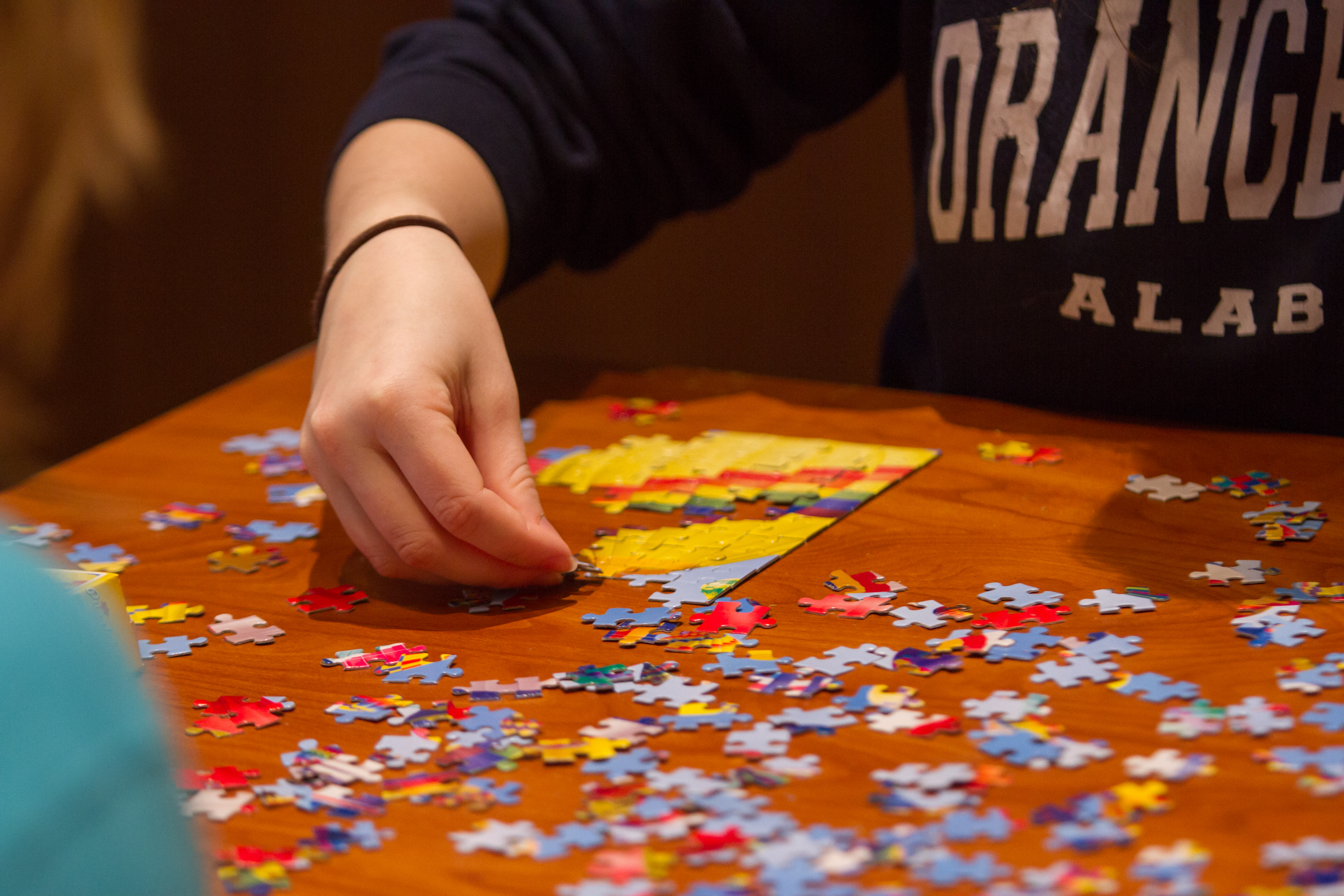 Student putting together a puzzle