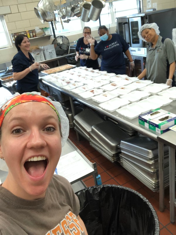 Nutrition Alum Prepping meals with coworkers