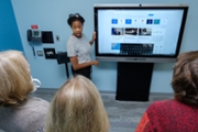 Faculty member Ashley Johnson working with a student in the new accessible classroom