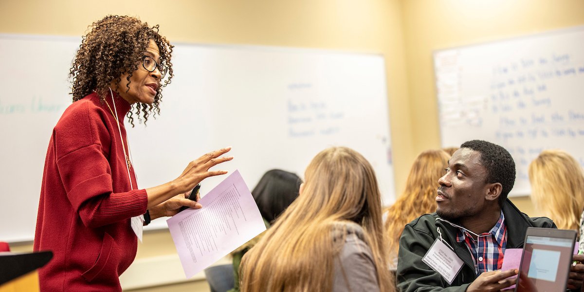 Professory leads students in a lecture.