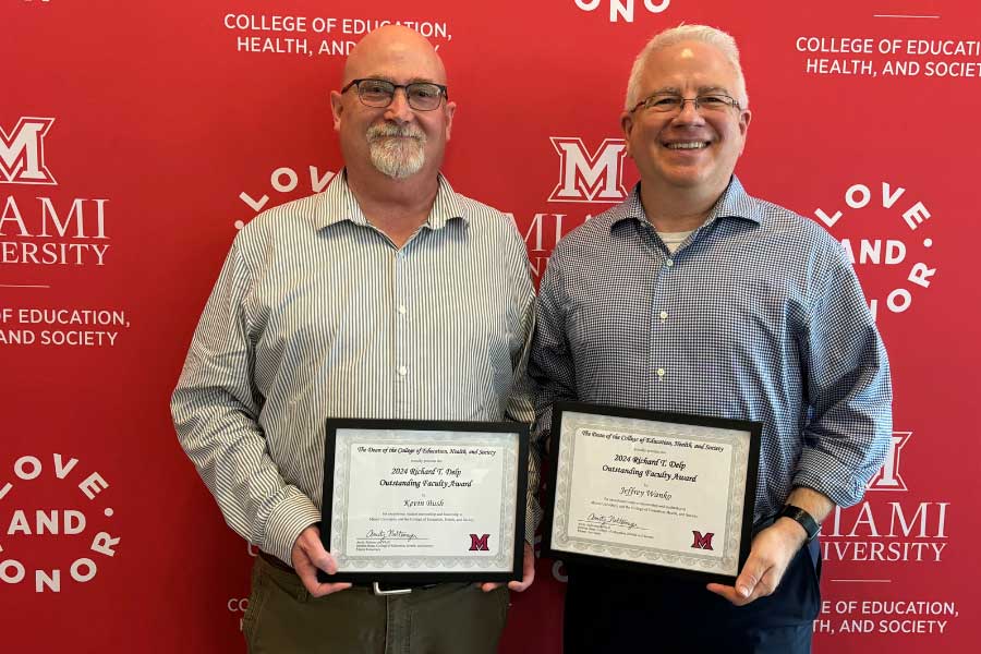 Kevin Bush and Jeffrey Wanko with award certificates