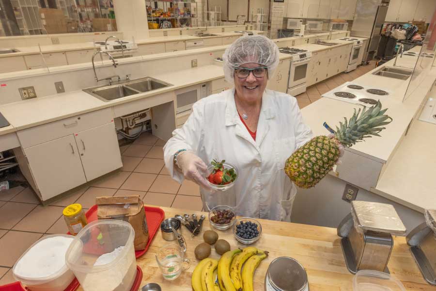 Nancy Parkinson holding ingredients