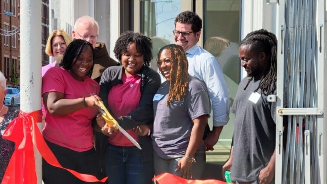 Urban Cohort students cutting a ribbon in Over the Rhine