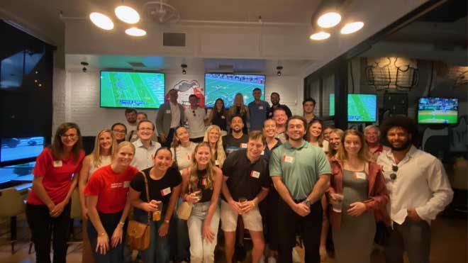SLAM alumni, Miami graduates, and sports industry professionals gathered for a picture