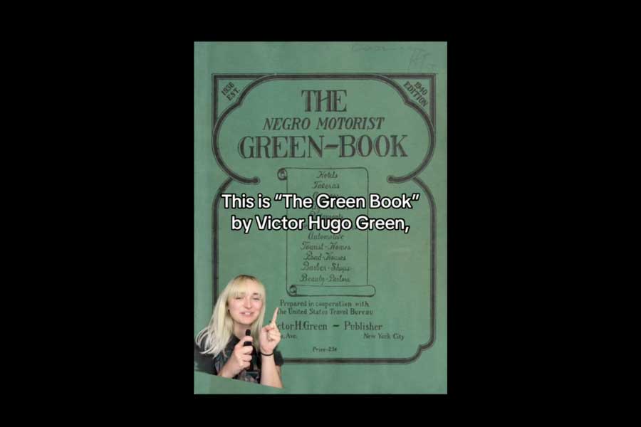 the cover of the Negro Motorist Green Book with a title overlay with the words This is the Green Book by Victor Hugo Green with a small cutout image of Gabrielle Byrd in the lower left corner pointing  towards the title overlay in the center of the overall image