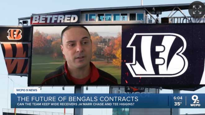 Adam Beissel pictured next to the Bengals logo superimposed on a Jumbotron in the Paycor Stadium