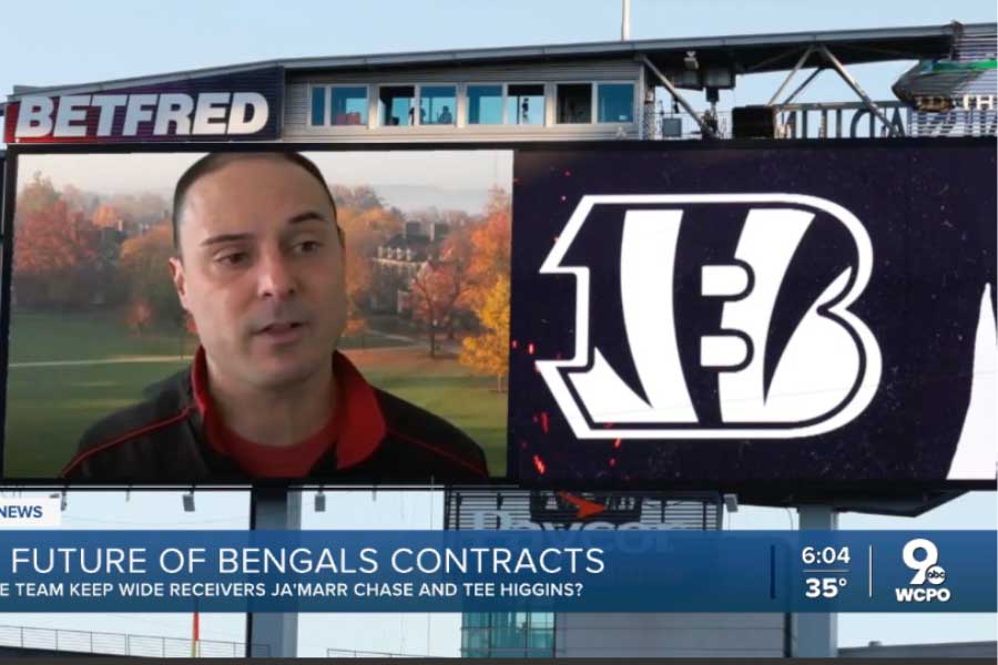 Adam Beissel pictured next to the Bengals logo superimposed on a Jumbotron in the Paycor Stadium