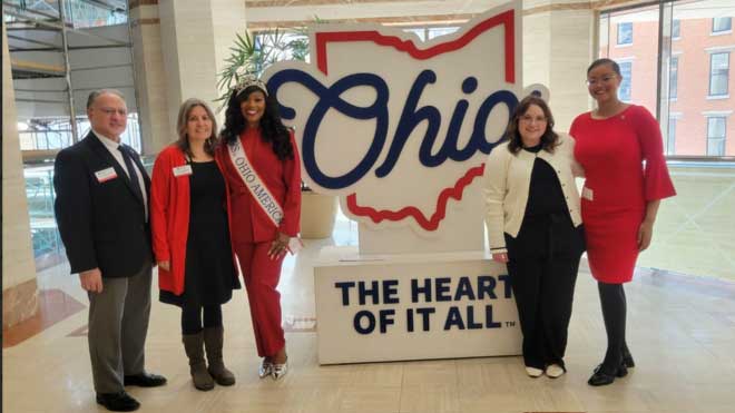 Miami representatives in front of the State of Ohio logo