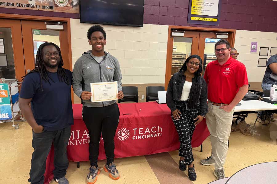 Prince Johnson, Camerin Scott, Syndnie Singleton, and Brian Schultz pose for a picture
