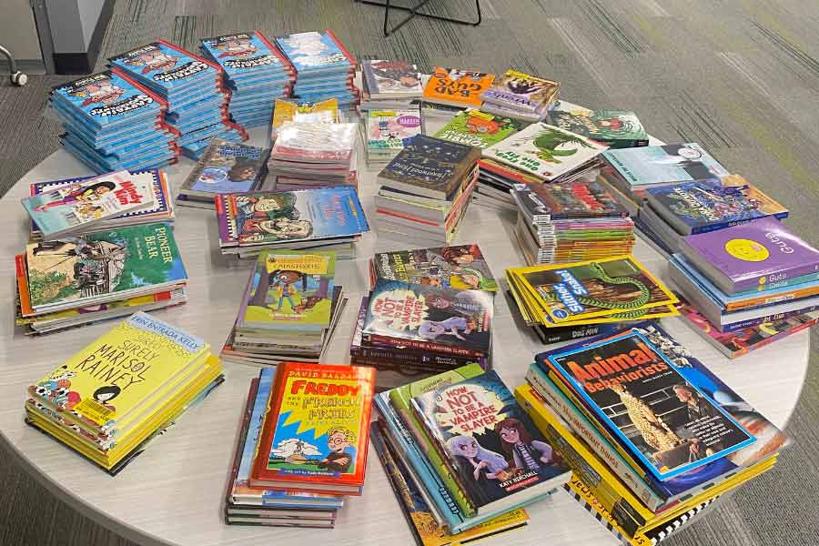 Collection of books stacked on a table
