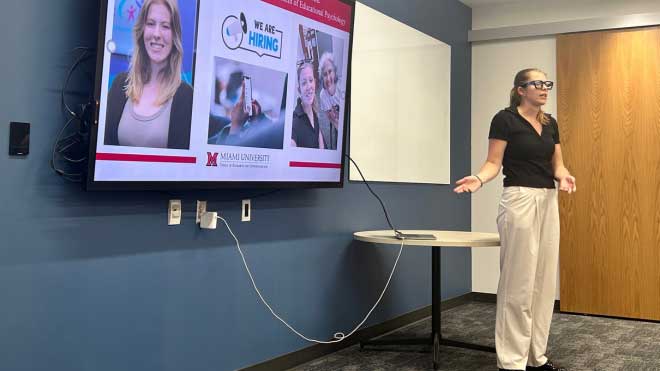 Janelle Tipton presenting research at the Fall Undergraduate Summer Scholars Showcase.