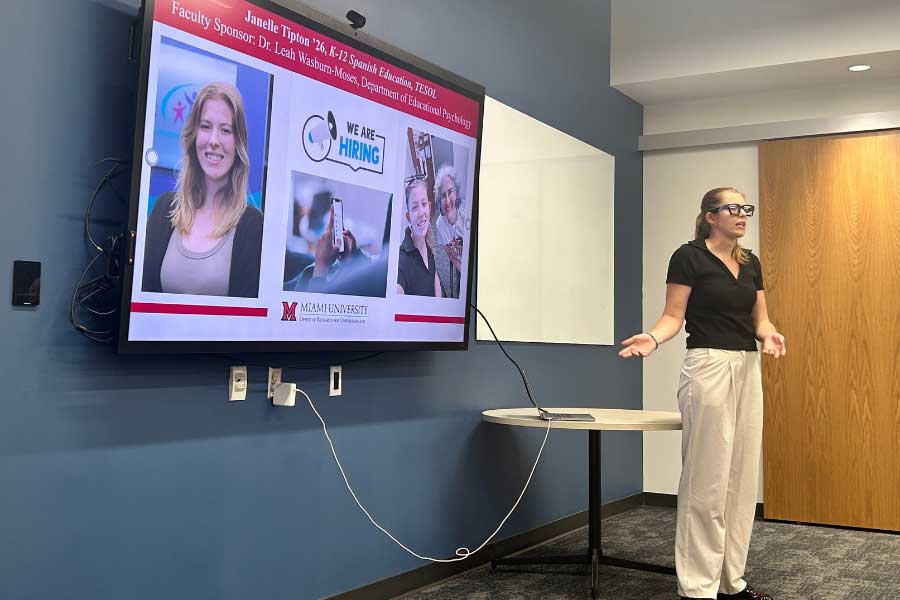 Janelle Tipton presenting research at the Fall Undergraduate Summer Scholars Showcase.