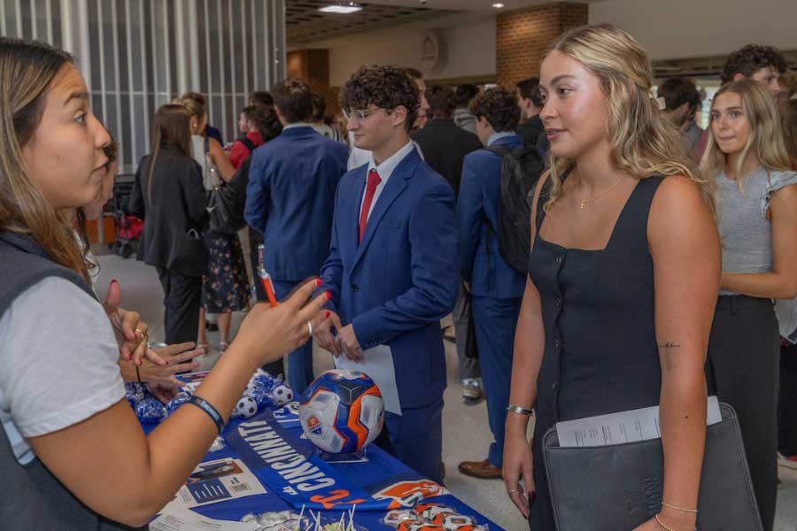 Students explore sports industry careers during SCENE at a table for FC Cincinnati at Miami University.