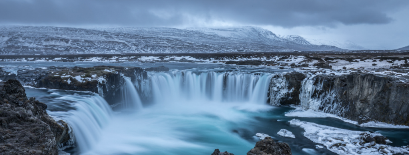 Photograph of an Icelandic waterfall and landscape.