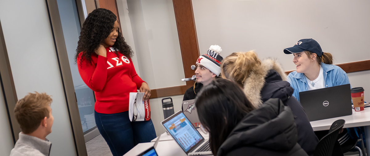 PCC team member assists student with Career Fair preparation