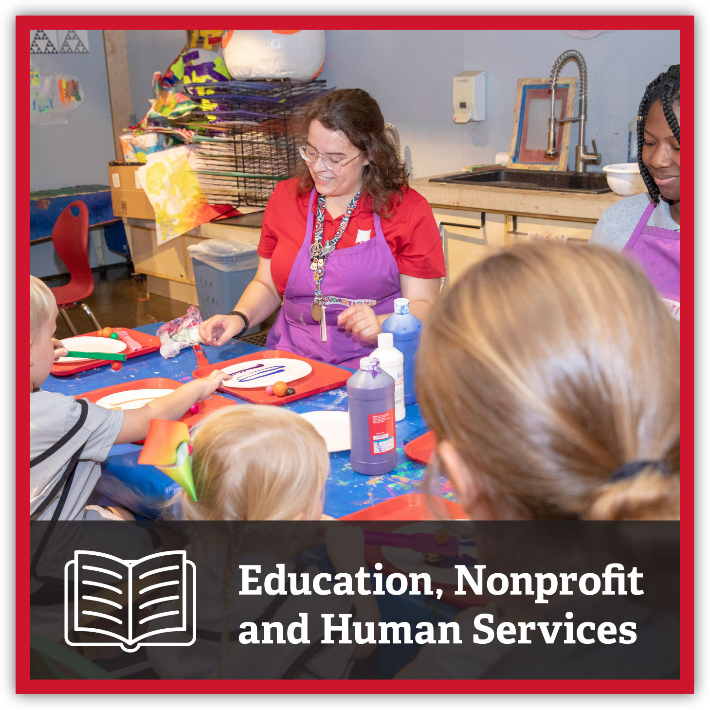 Woman working with children in classroom, Nonprofit and Human Services.