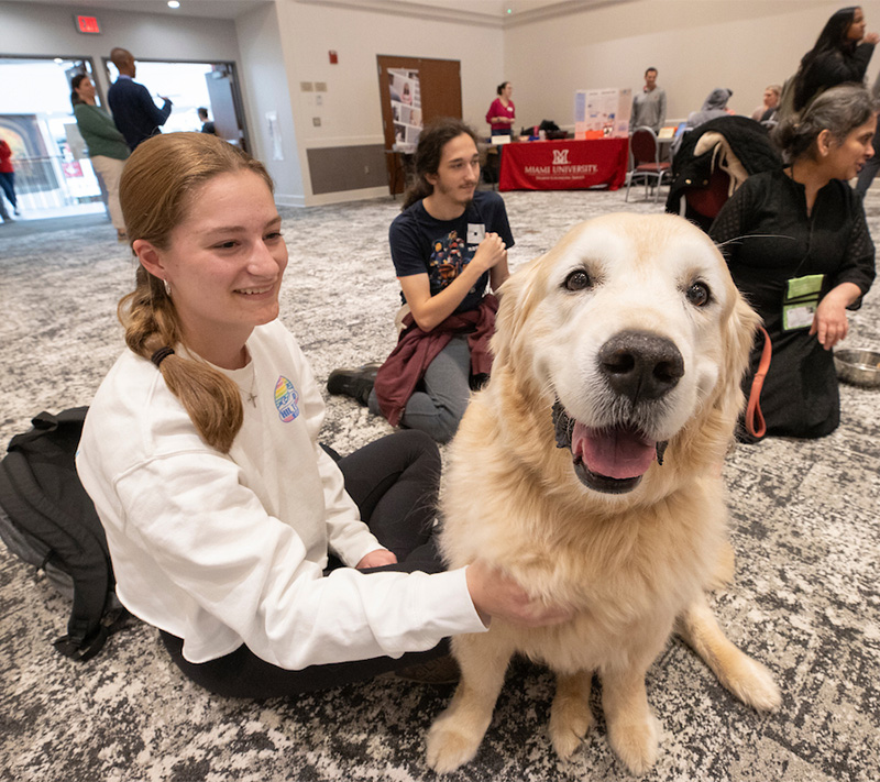 student with a therapy dog