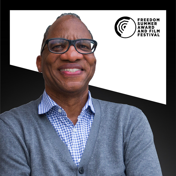 Wil Haygood in front of a graphic stylized background