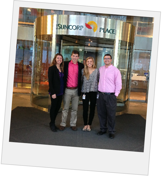 Polaroid of students standing at the revolving door entrance of 'Suncorp Place'
