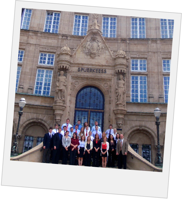 Polaroid of students in front of an old building with ornate architecture