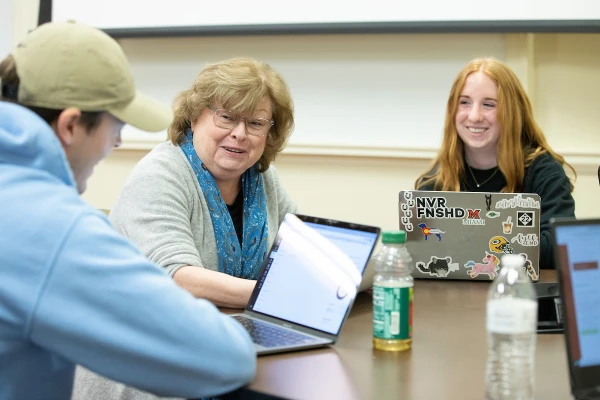 jan taylor with two students in marketing class