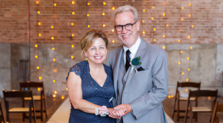 Scott and Margie dressed up posing for a picture