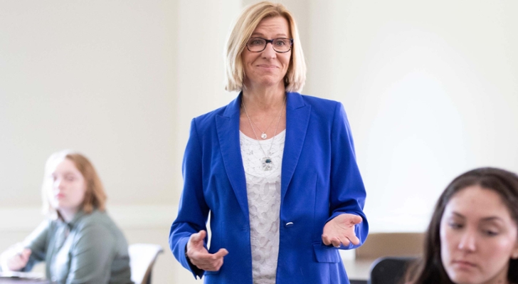 Lise Ellram standing in class 