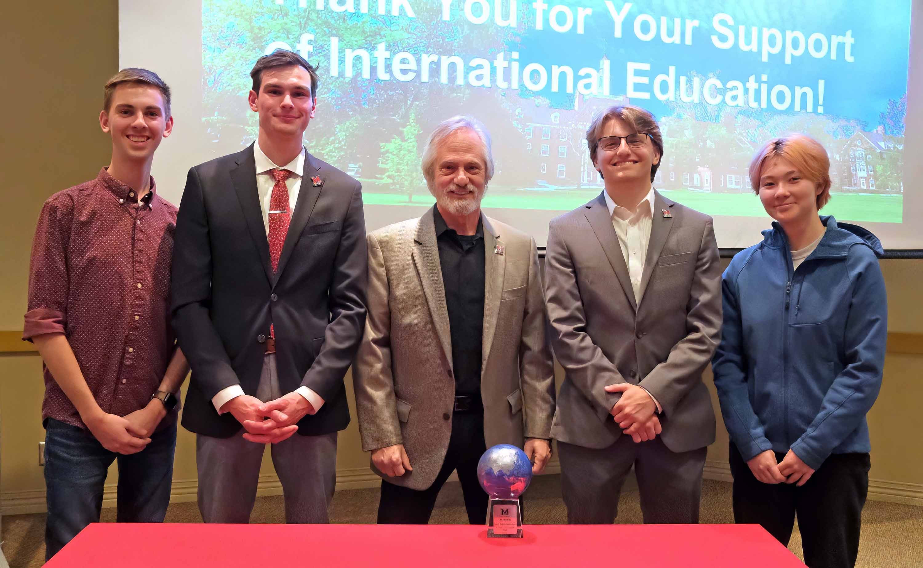 Jim Friedman and students at awards ceremony