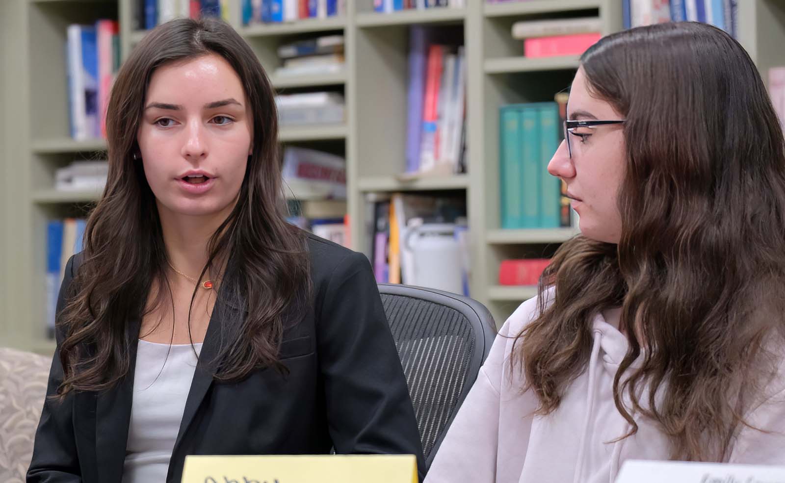 Female student talking to group