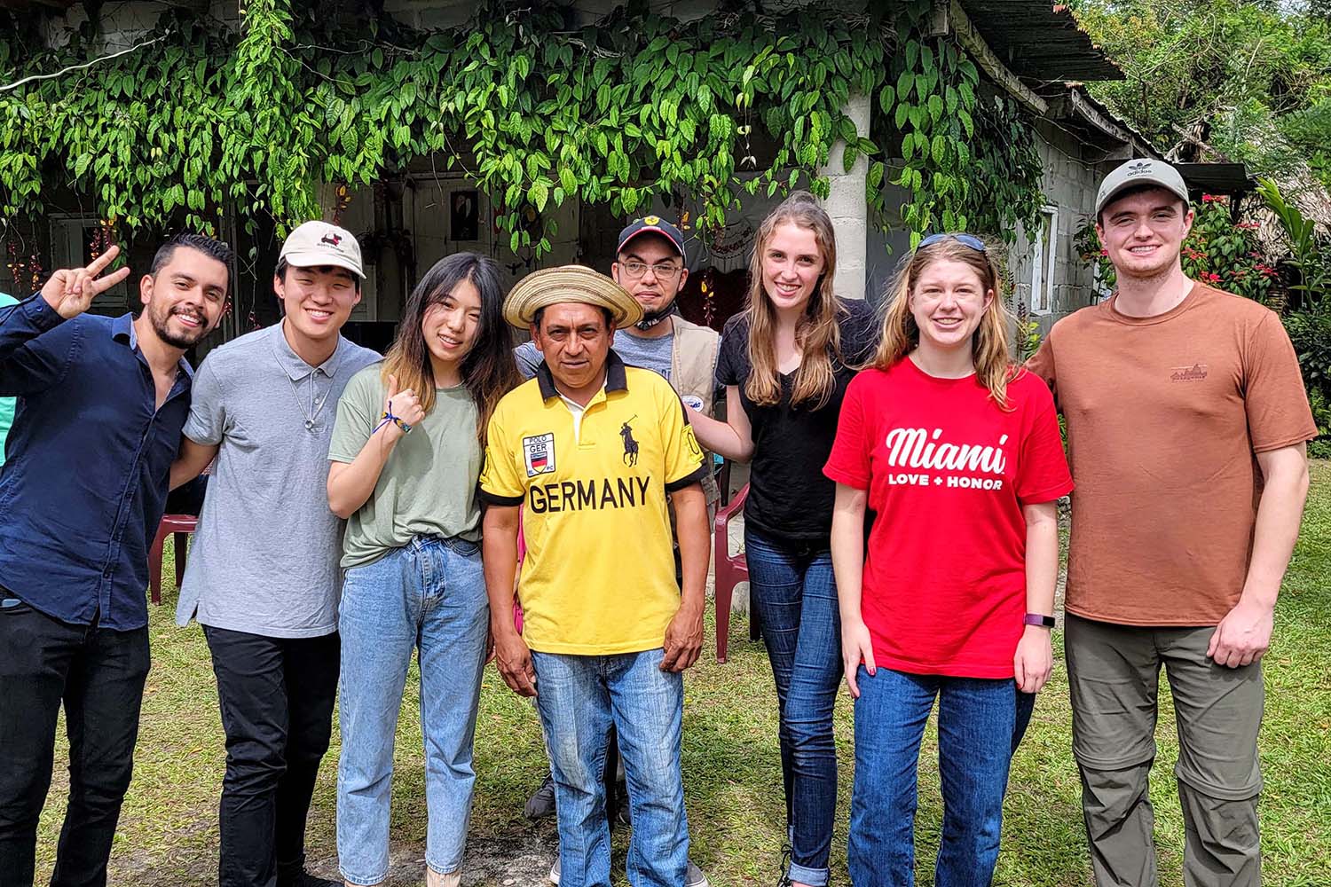 Students pose with villager