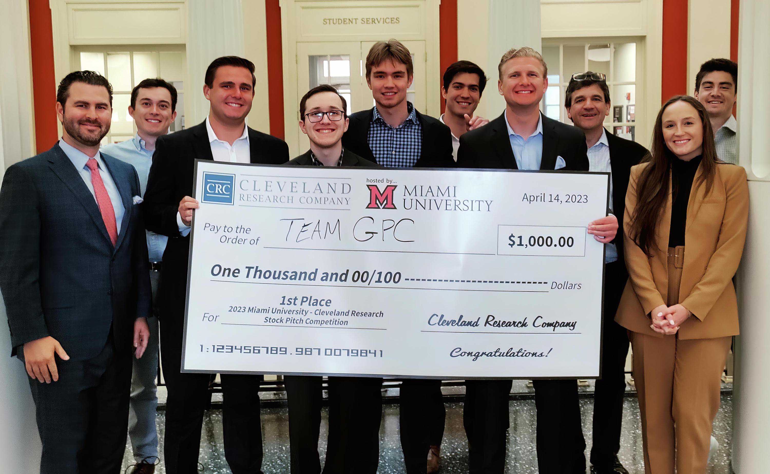 Group photo with big check