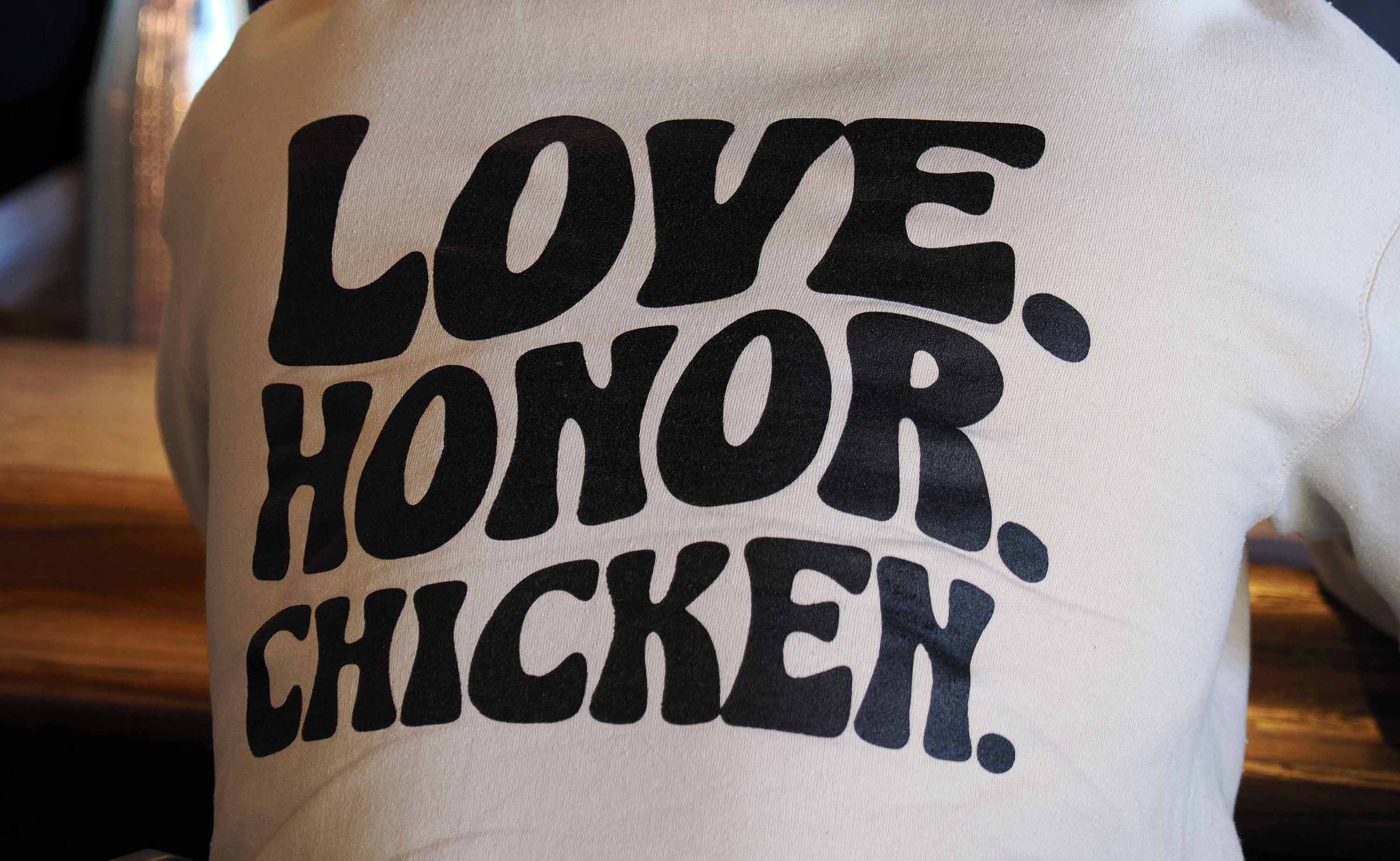 Love. Honor. Chicken. on the back of a shirt