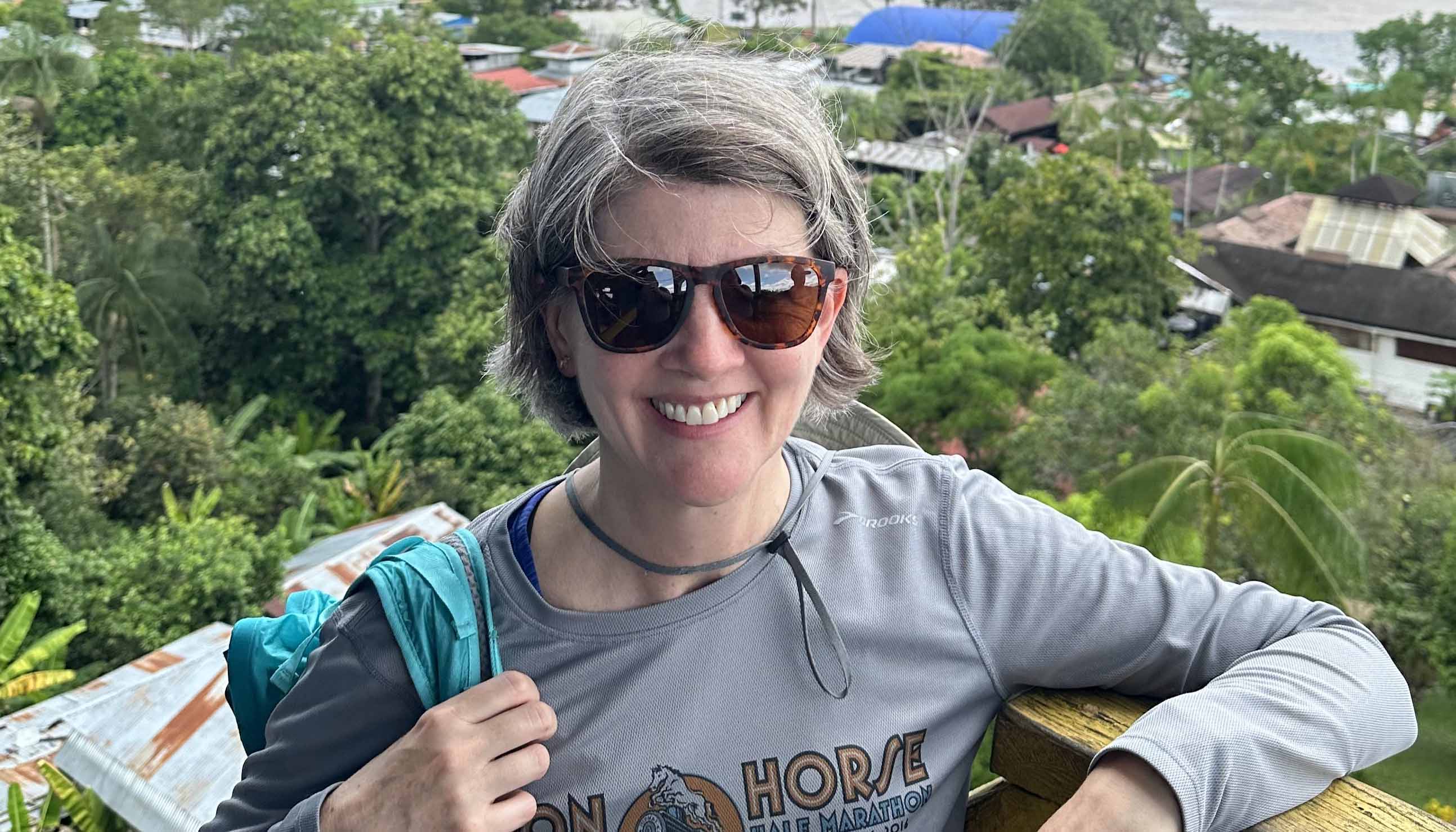 Jenny Minier on a balcony overlooking a Colombian city