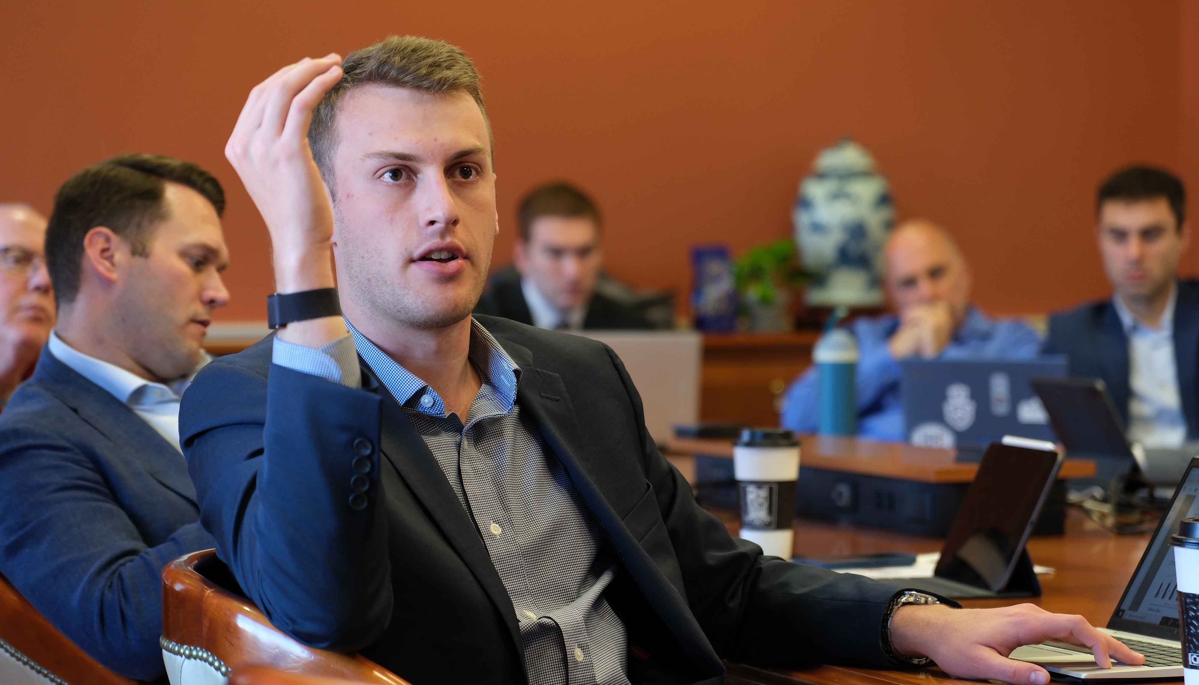 William Blair associate asking a question of a team
