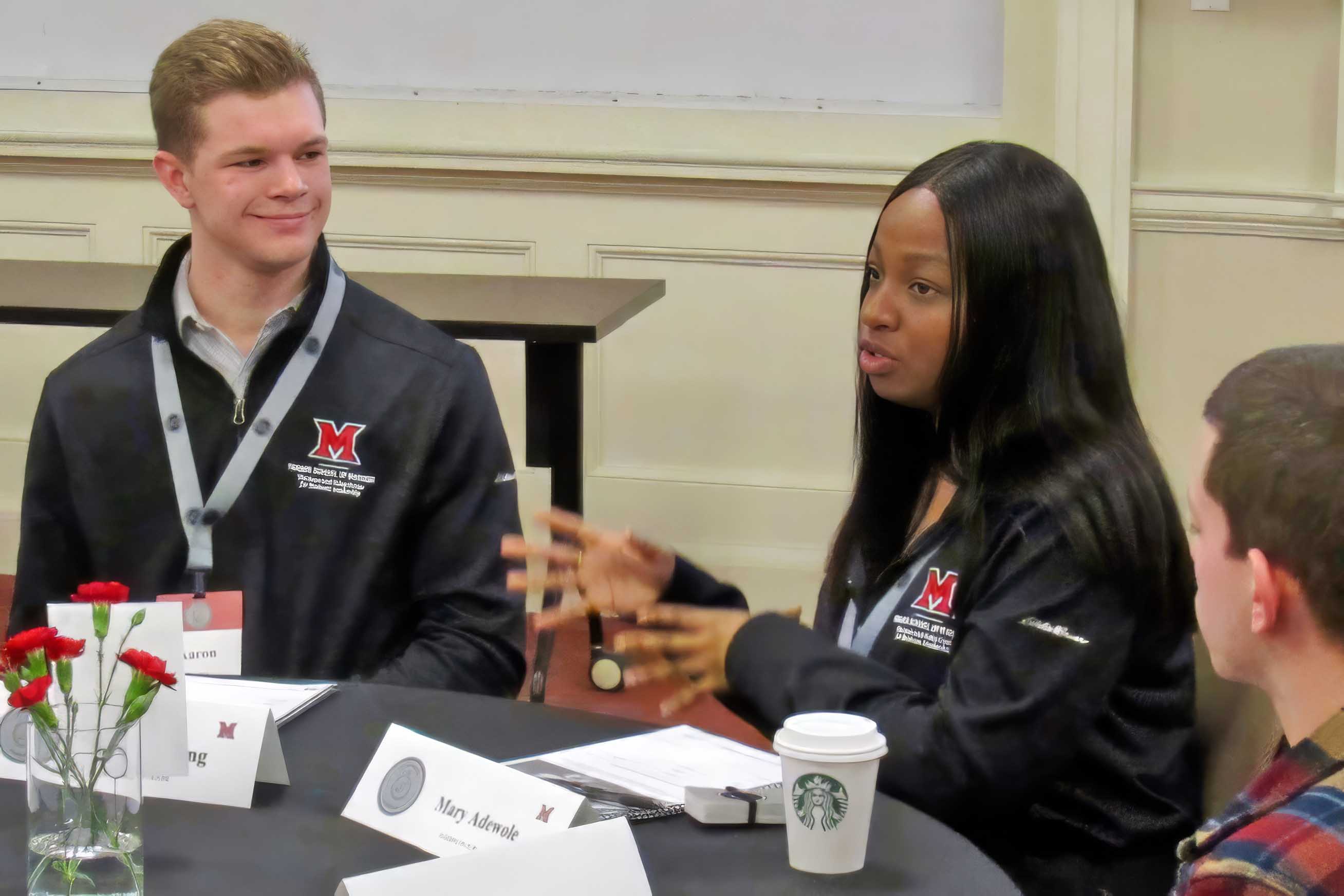 Students talking with one another during the seminar