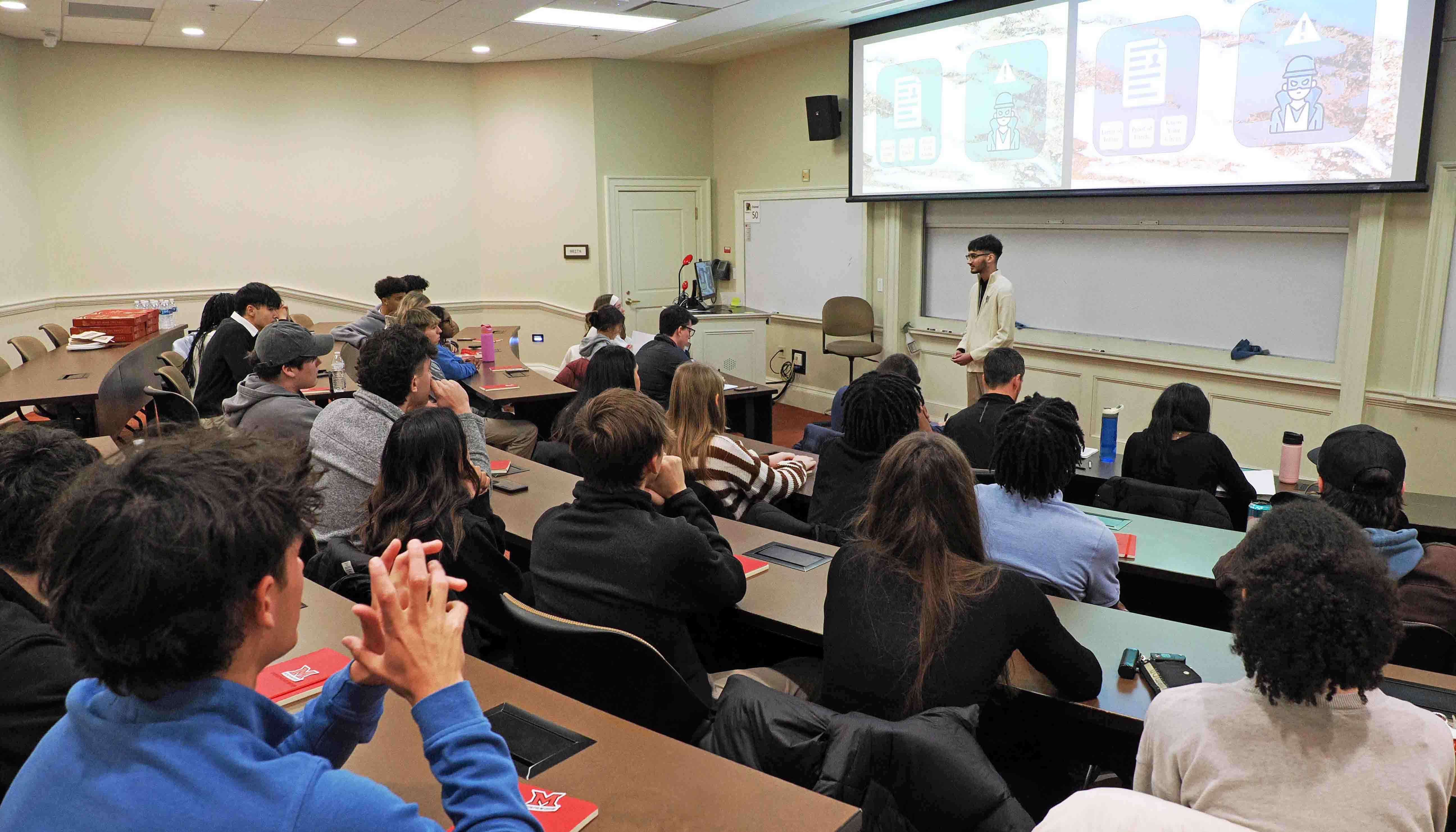 Student presenting in front of classmates