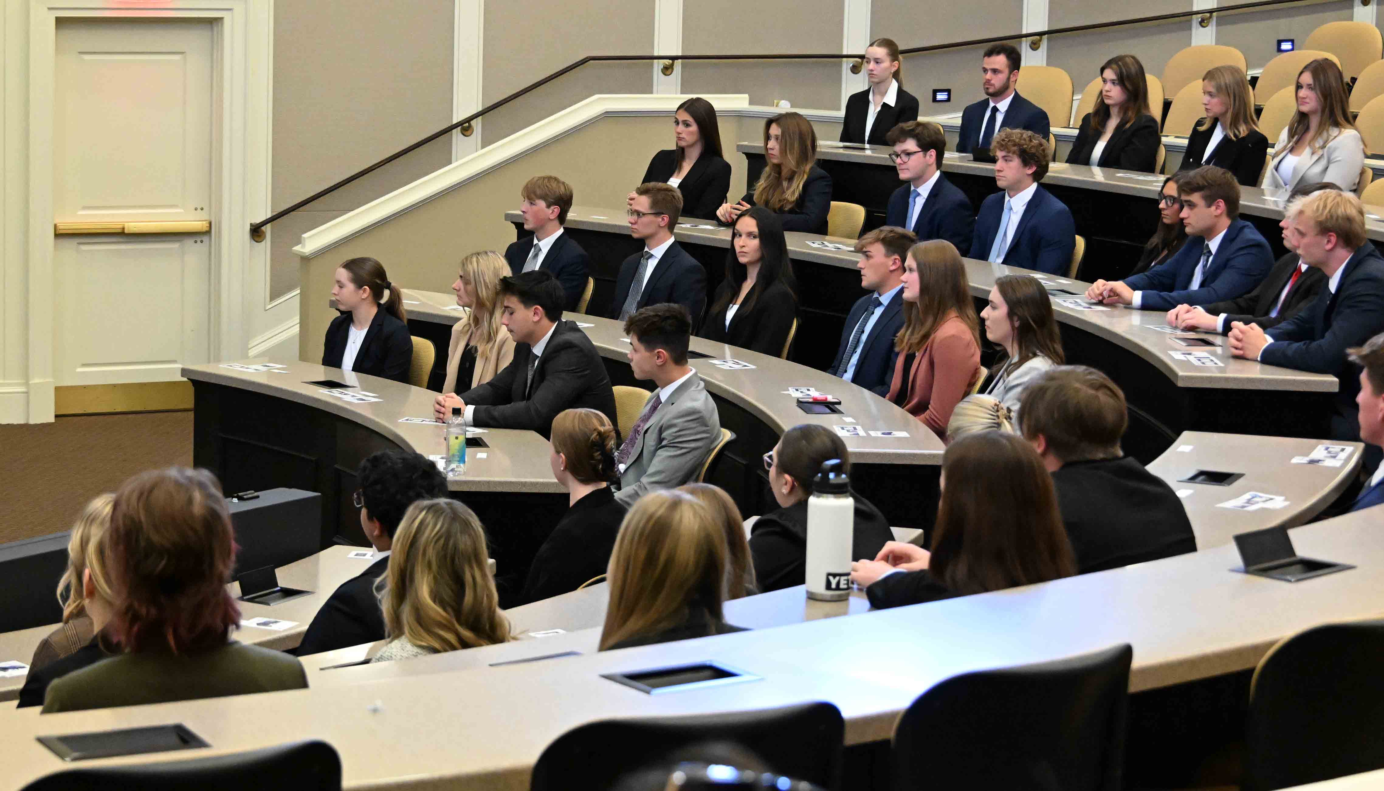 Students wait to be called to the front