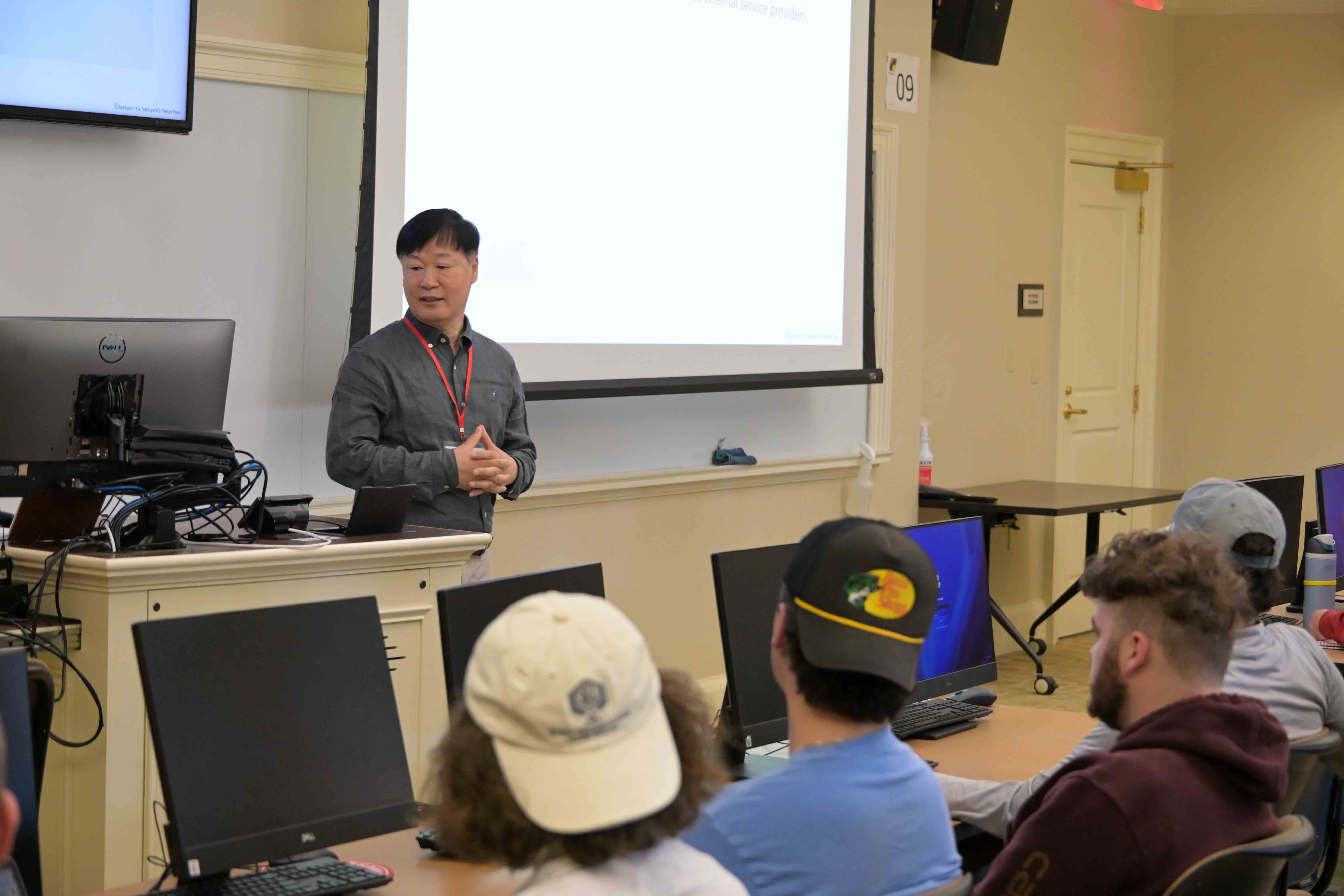Higgin Kim participant talks to class