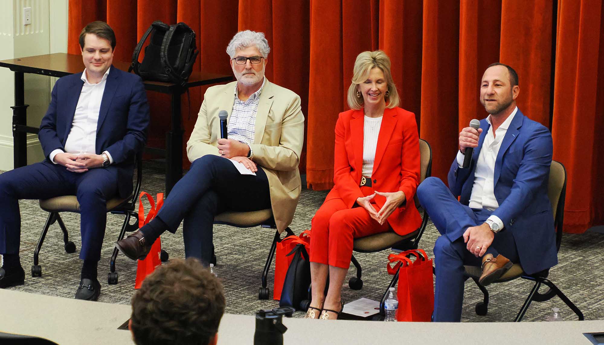 (L-R) Michael Loffredo, Tony Longi, Tracey Stofa, and Joel Dumes talk with students
