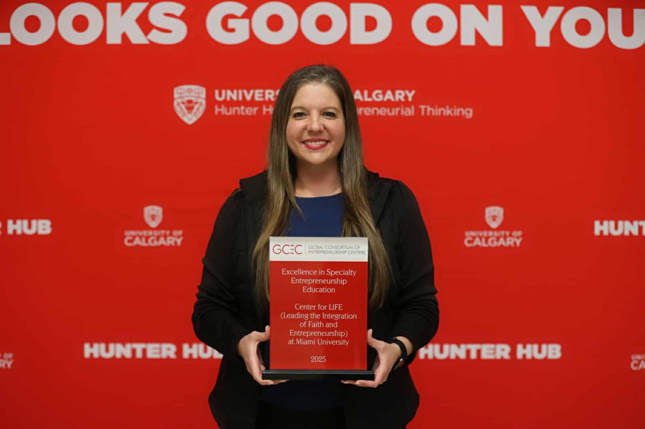 Jen Bennett poses with award