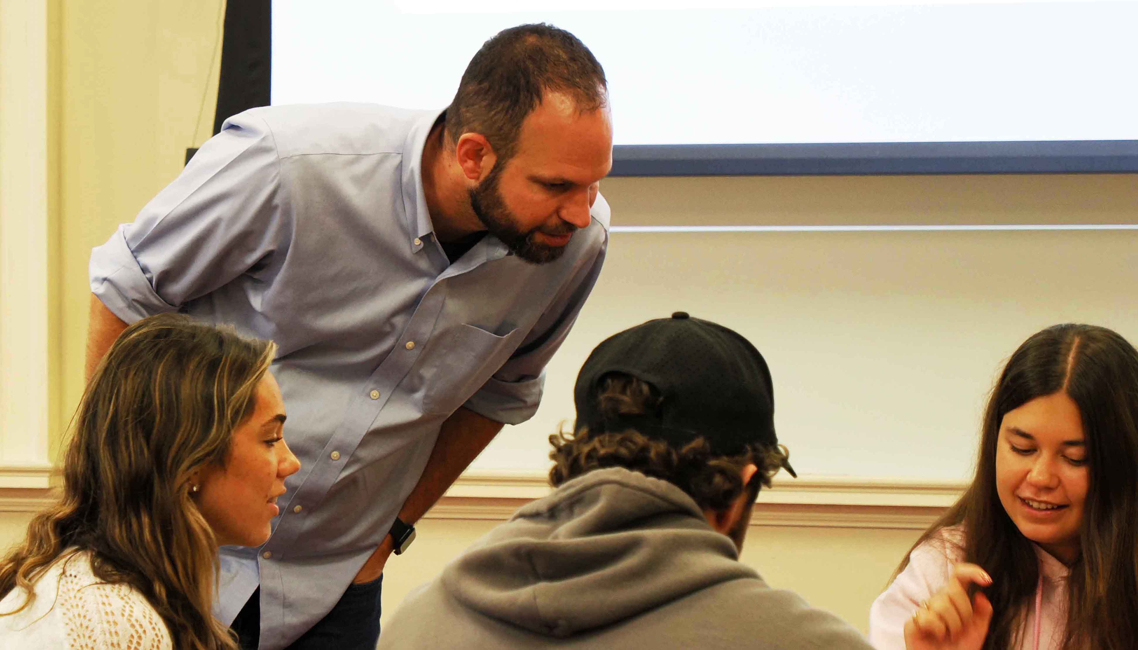 Cory Driver talking with students