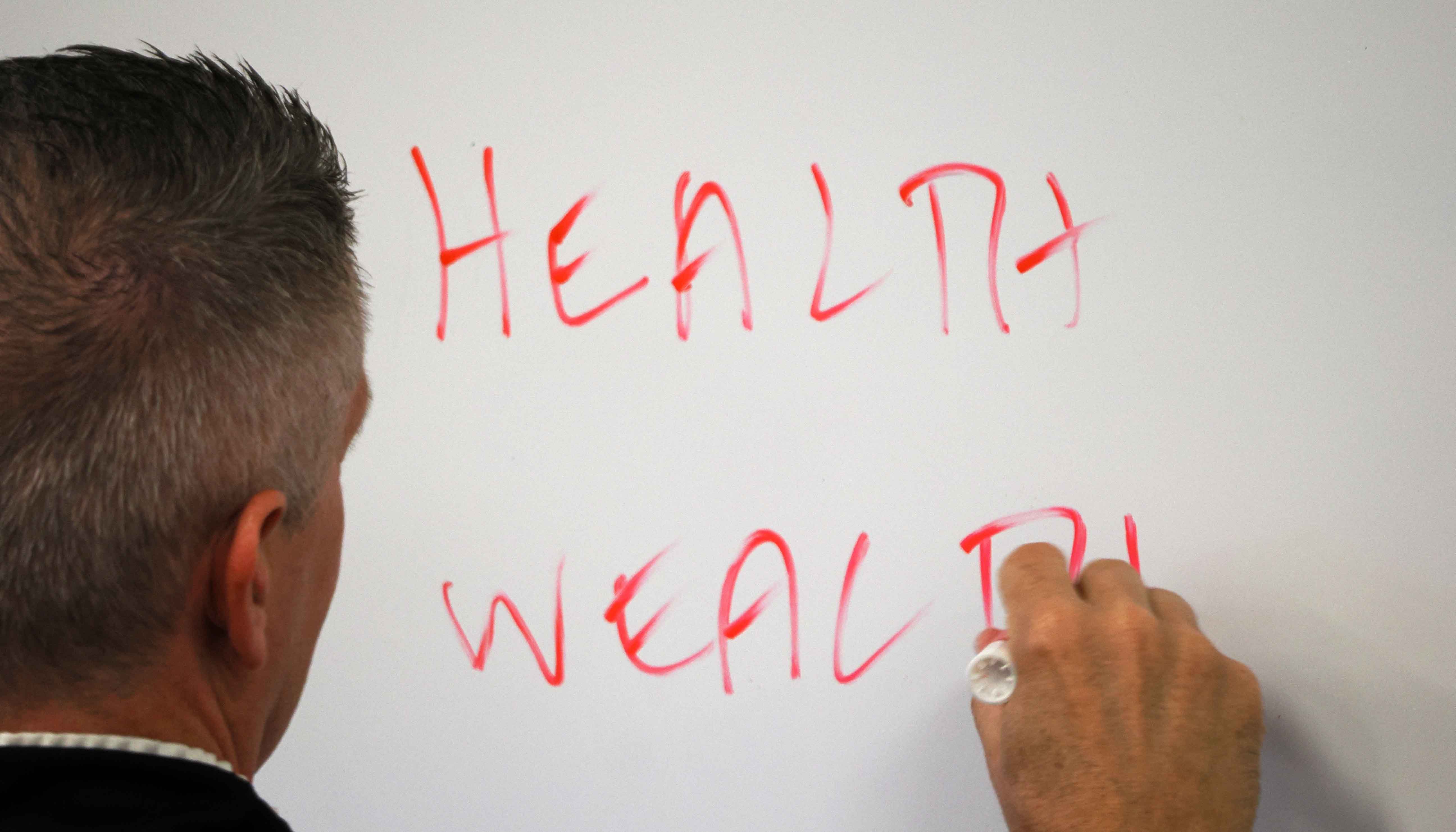 Brett Smith writes on a whiteboard