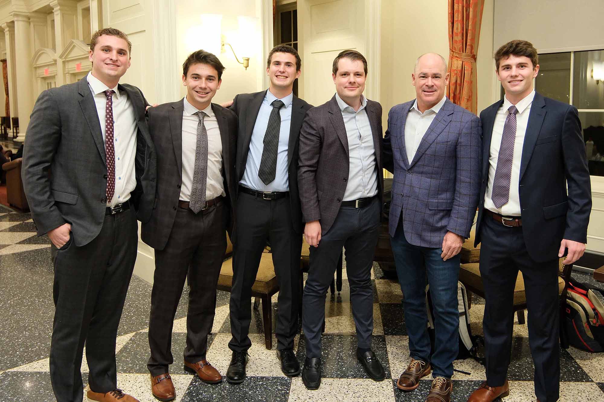 Winning team members and William Blair officials