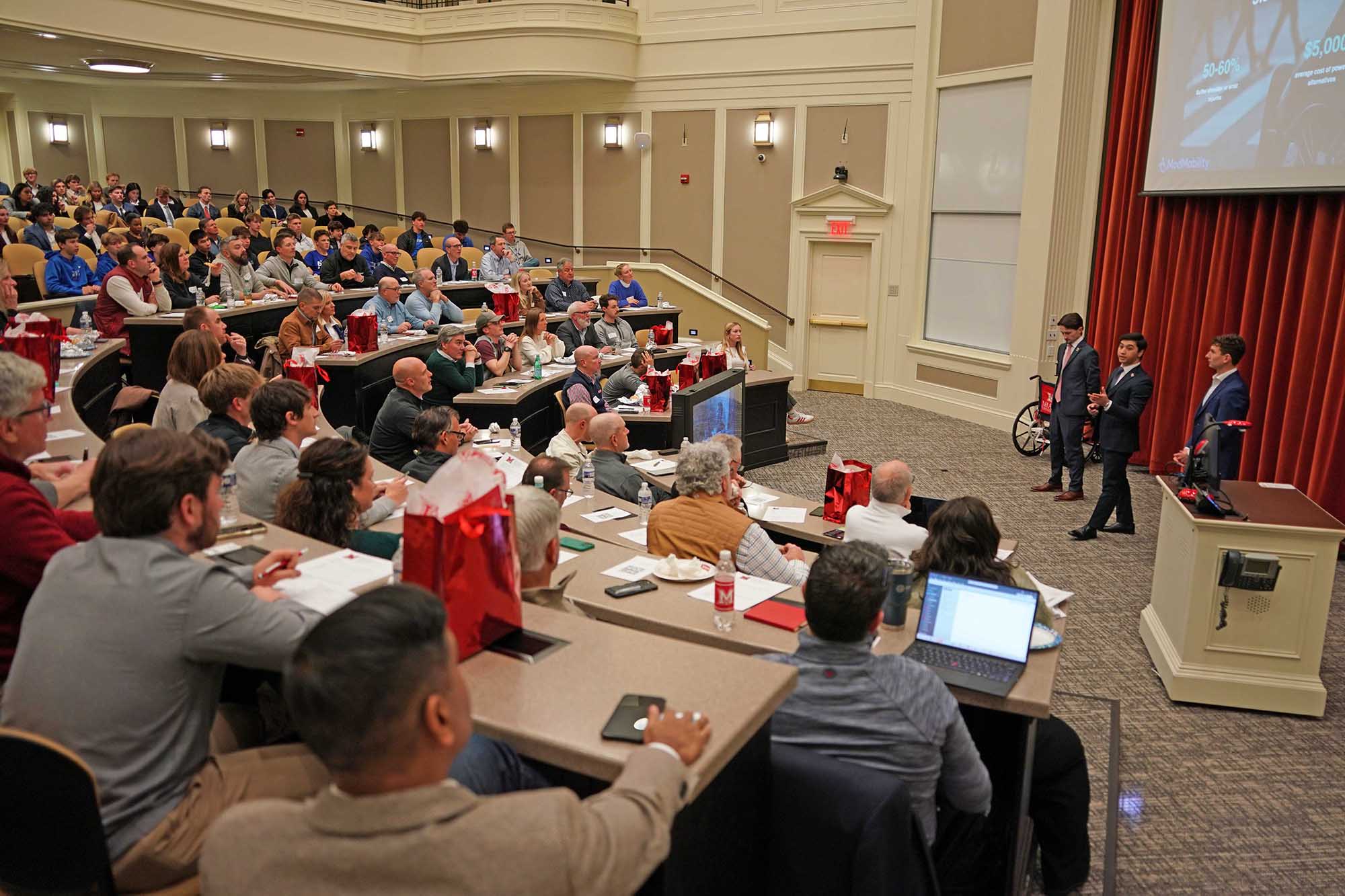 Students present to mentors and judges in finals