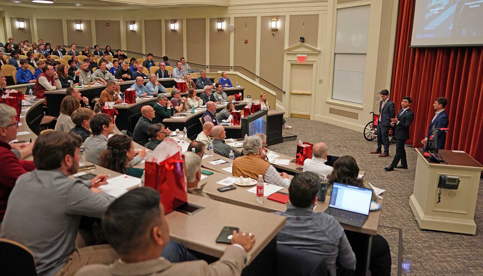 Students present to mentors and judges in finals