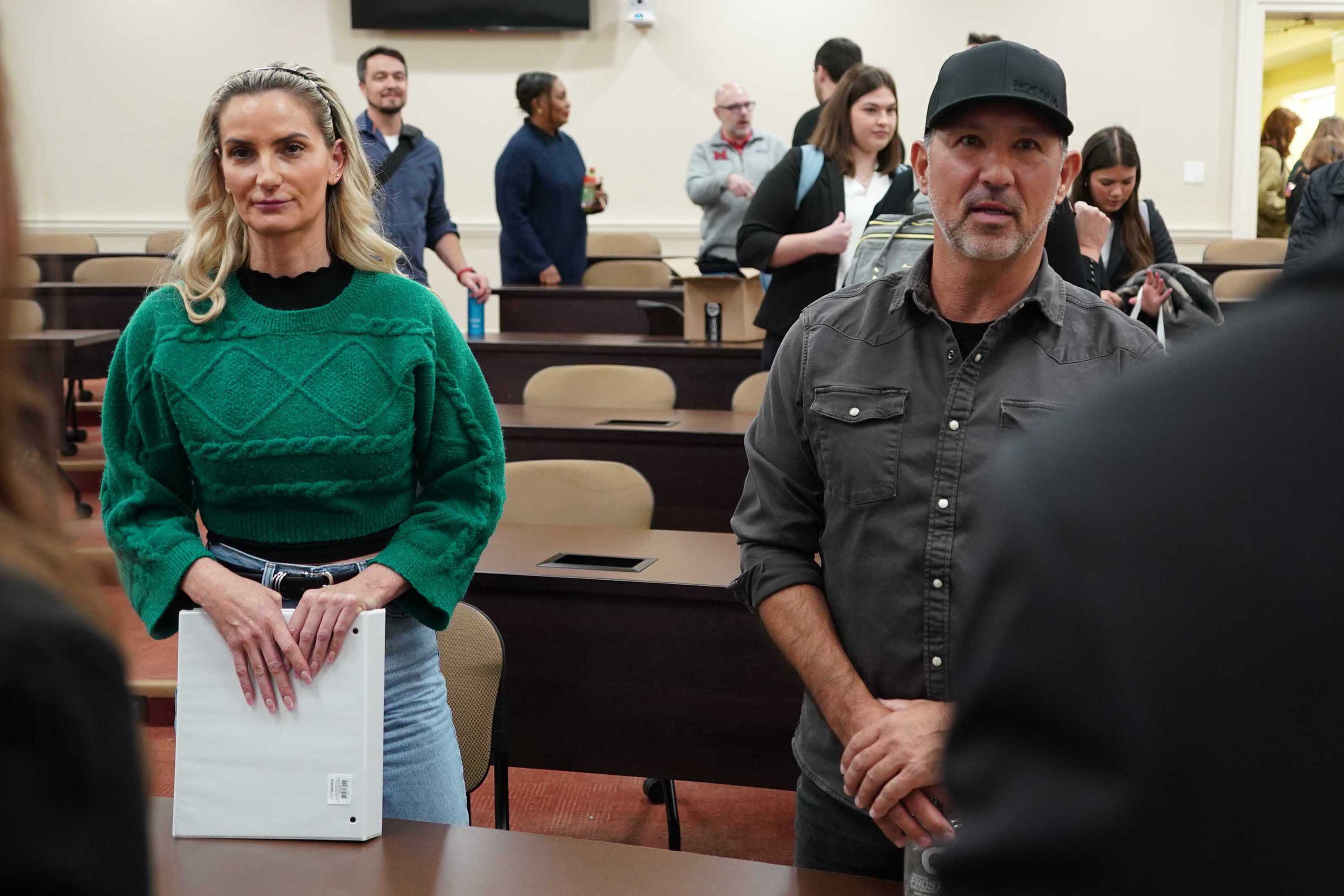 Billy Rossini and Heidi Klein talk with students after the final presentations
