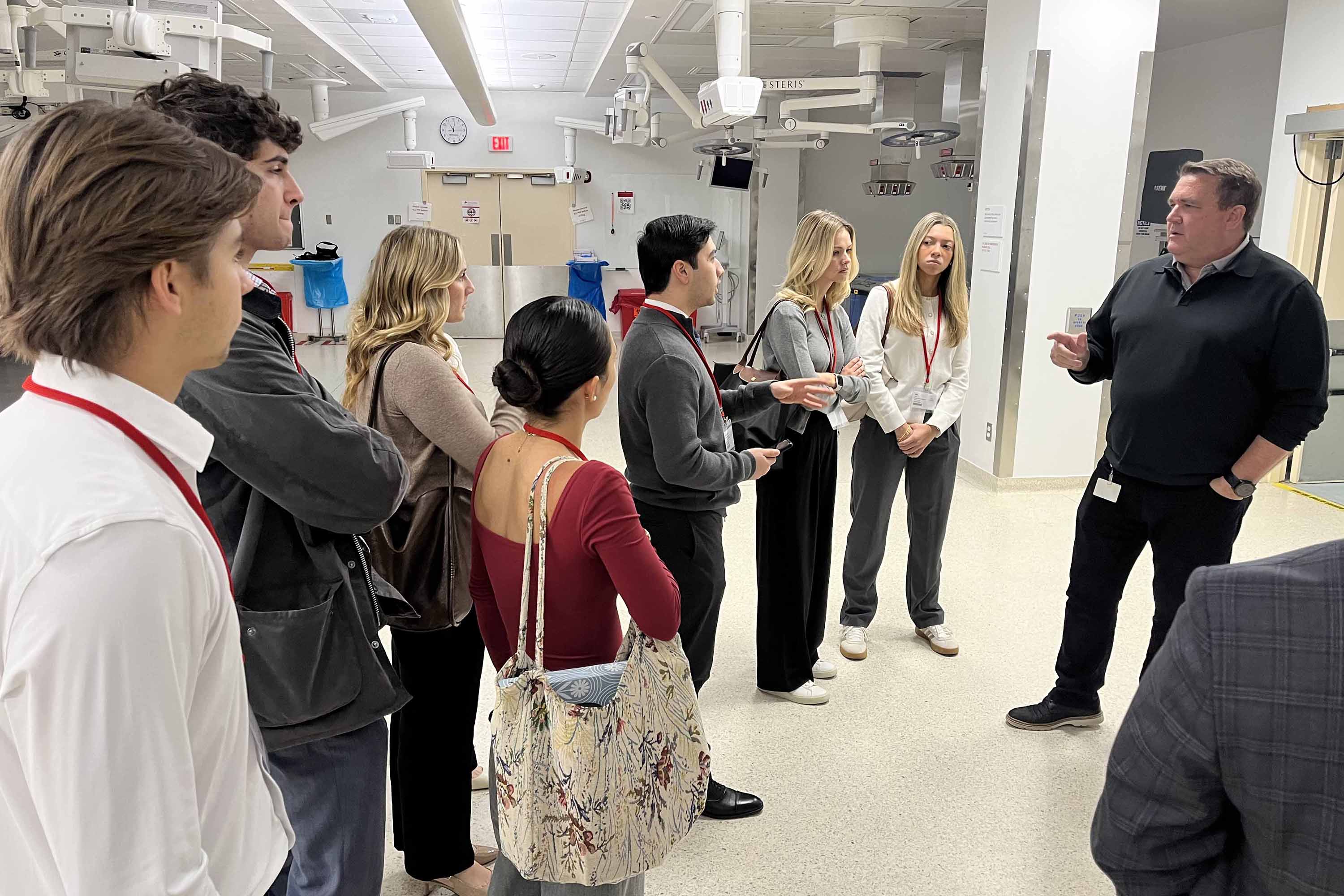 Students talk with a healthcare executive