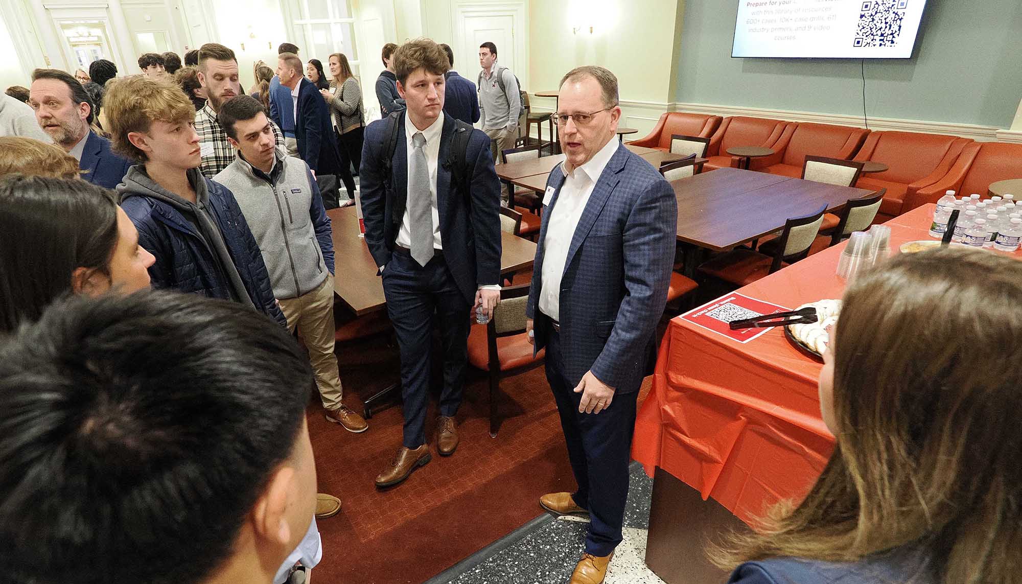Students talk with Scott Green ‘88, Senior Vice President of Wealth Management at UBS Financial Services, at the kickoff event for the two new programs