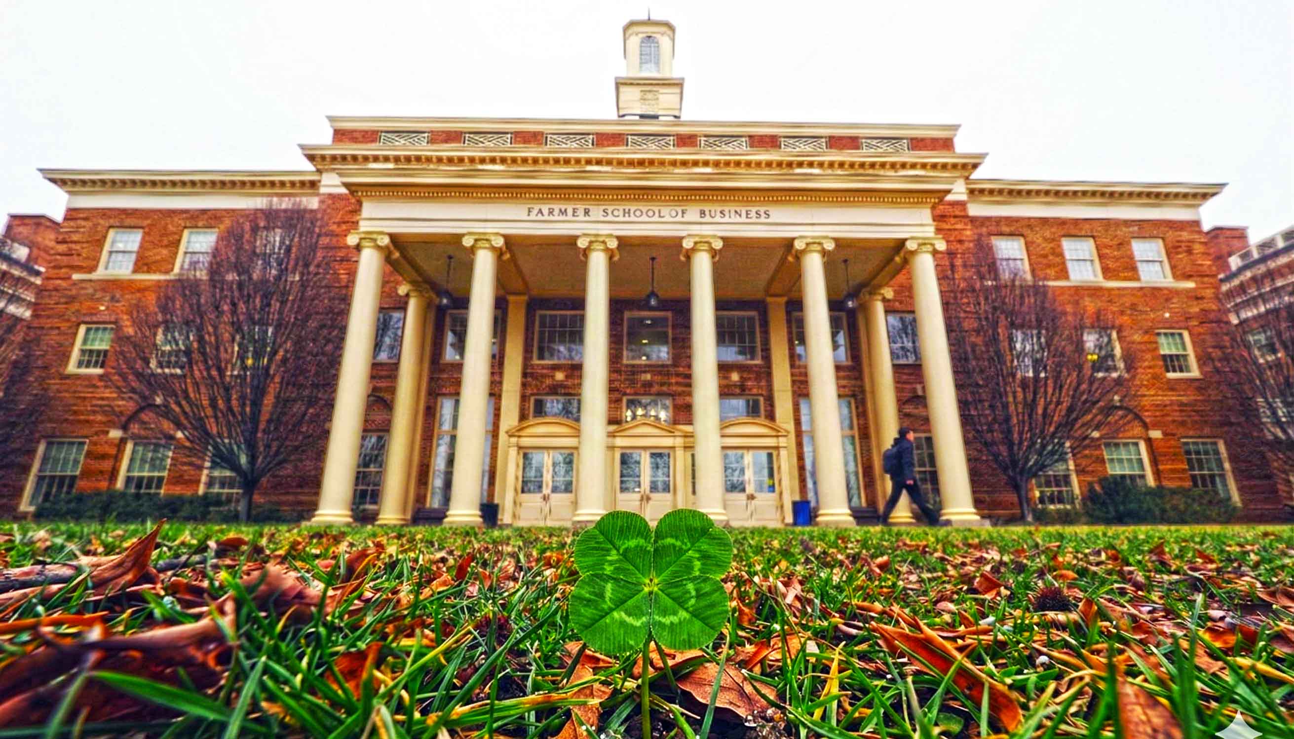 The Farmer School of Business with a clover added the front lawn
